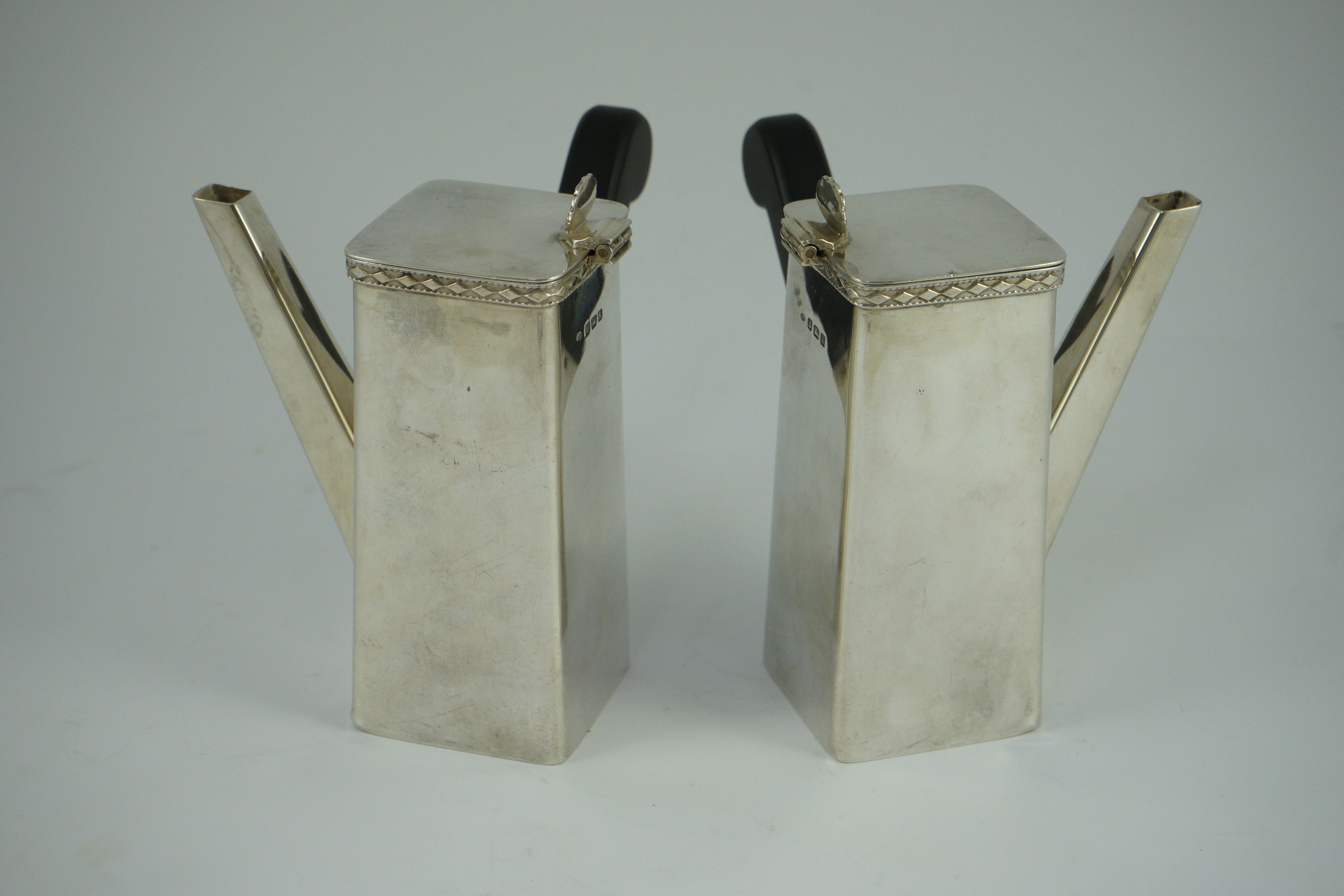 A stylish pair of George V silver cafe au lait pots, by Bert Gordon